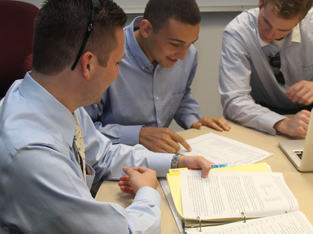 Accounting students looking at reports.
